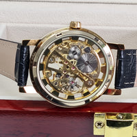 gold mechanical wrist watch with brown band